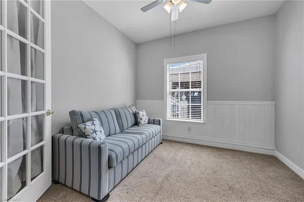 a living room with furniture and a window