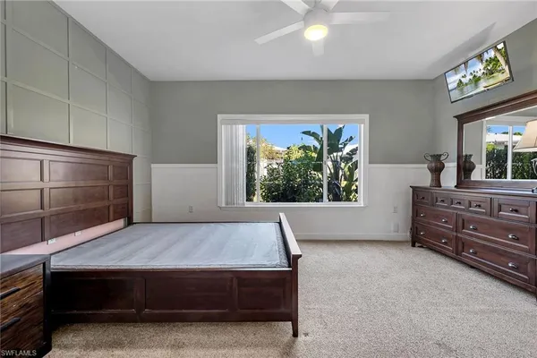a view of room with window and furniture
