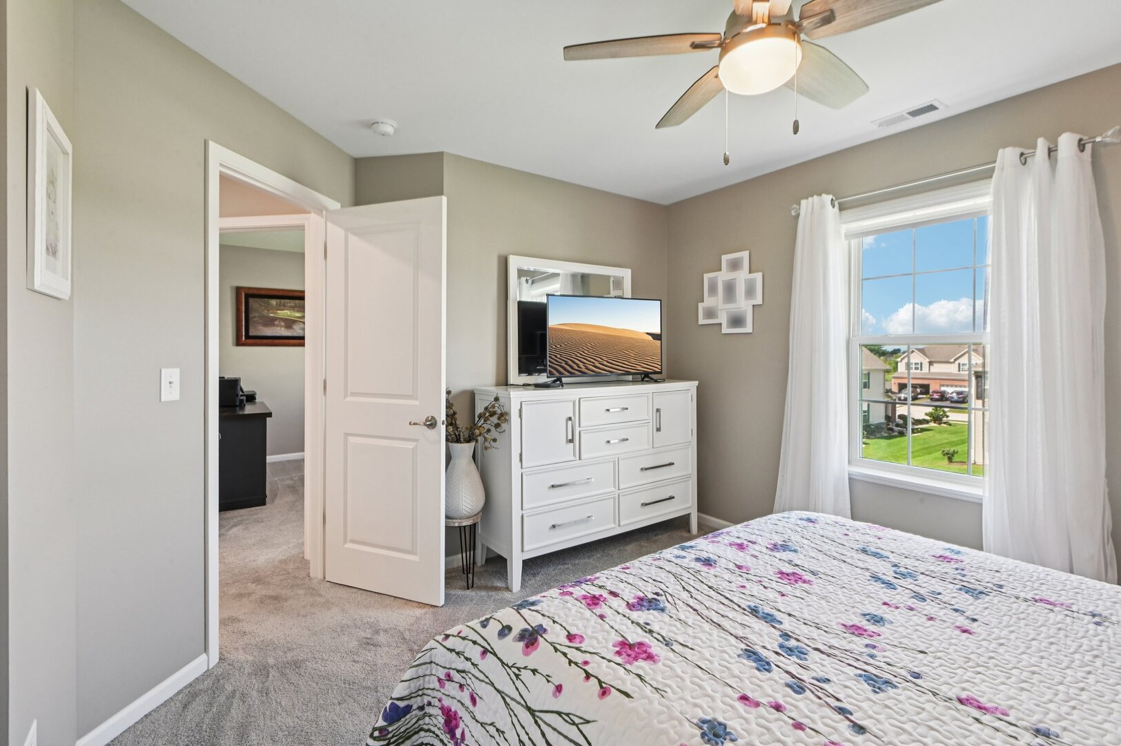 24734 South Dart Road Manhattan, IL 60442 - Photo 14 of 29 a bedroom with a bed and a flat screen tv