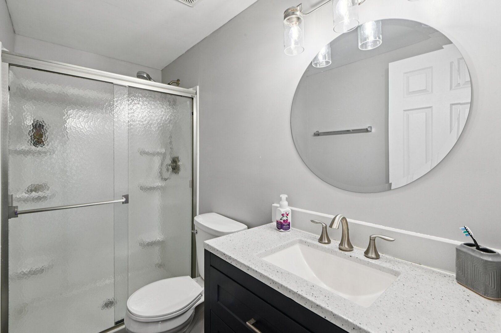 24734 South Dart Road Manhattan, IL 60442 - Photo 19 of 29 a bathroom with a sink a toilet and shower