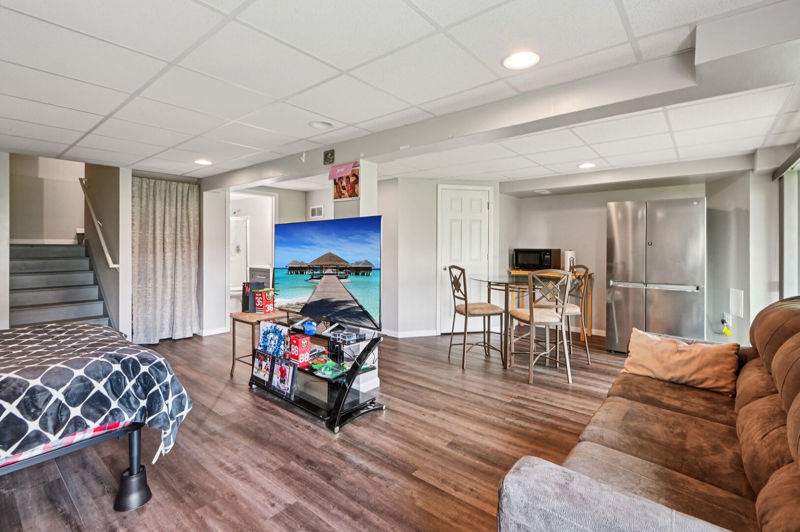 24734 South Dart Road Manhattan, IL 60442 - Photo 22 of 29 a living room with furniture a dining table wooden floor and a fireplace