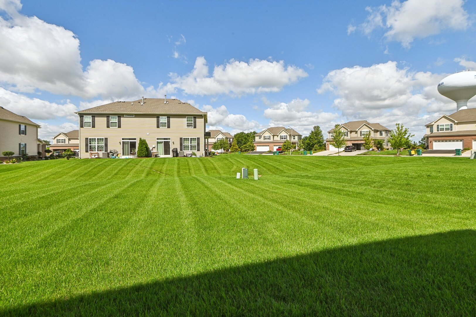 24734 South Dart Road Manhattan, IL 60442 - Photo 28 of 29 a view of a big house with a big yard and large trees
