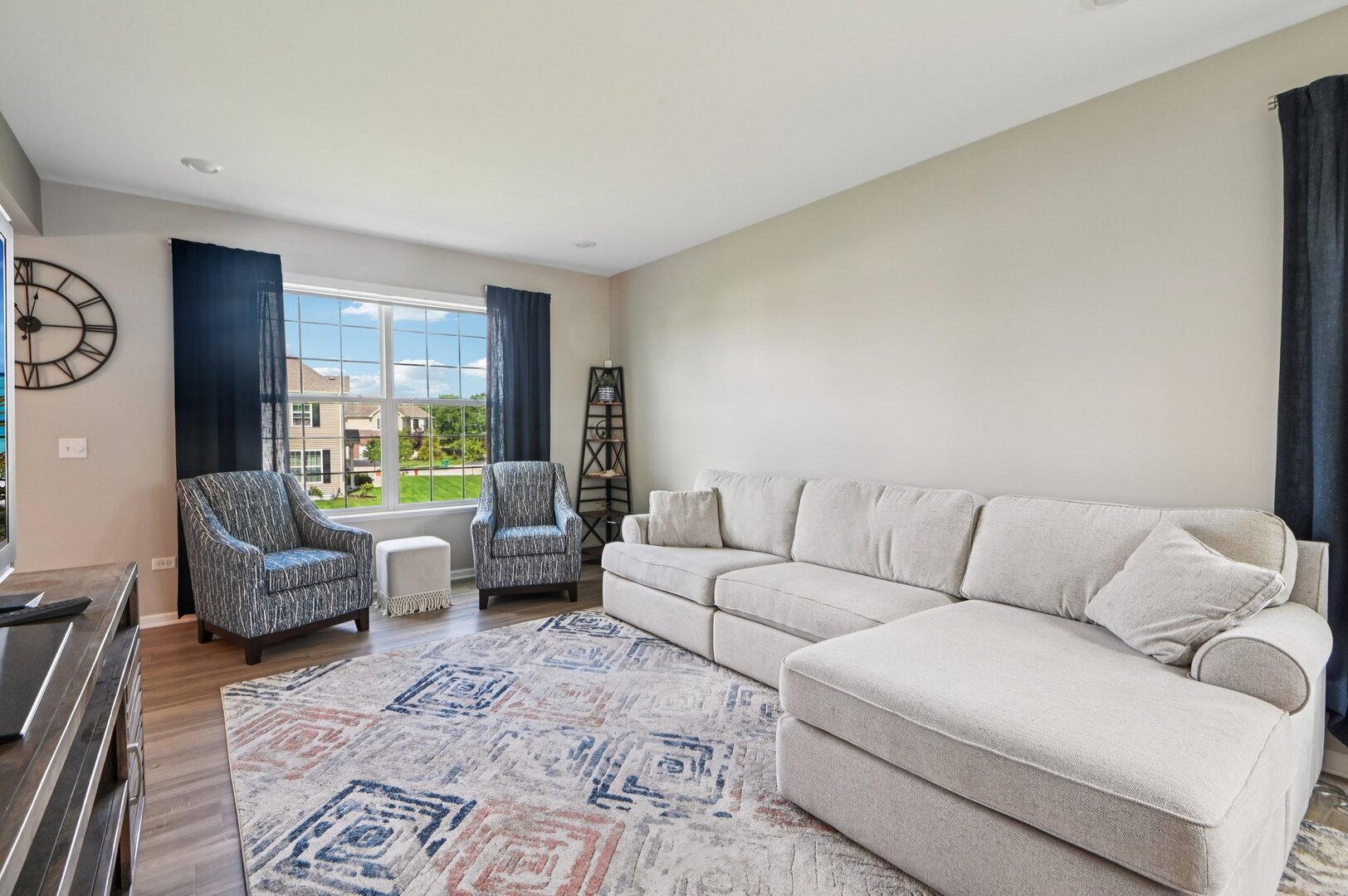24734 South Dart Road Manhattan, IL 60442 - Photo 3 of 29 a living room with furniture and a large window
