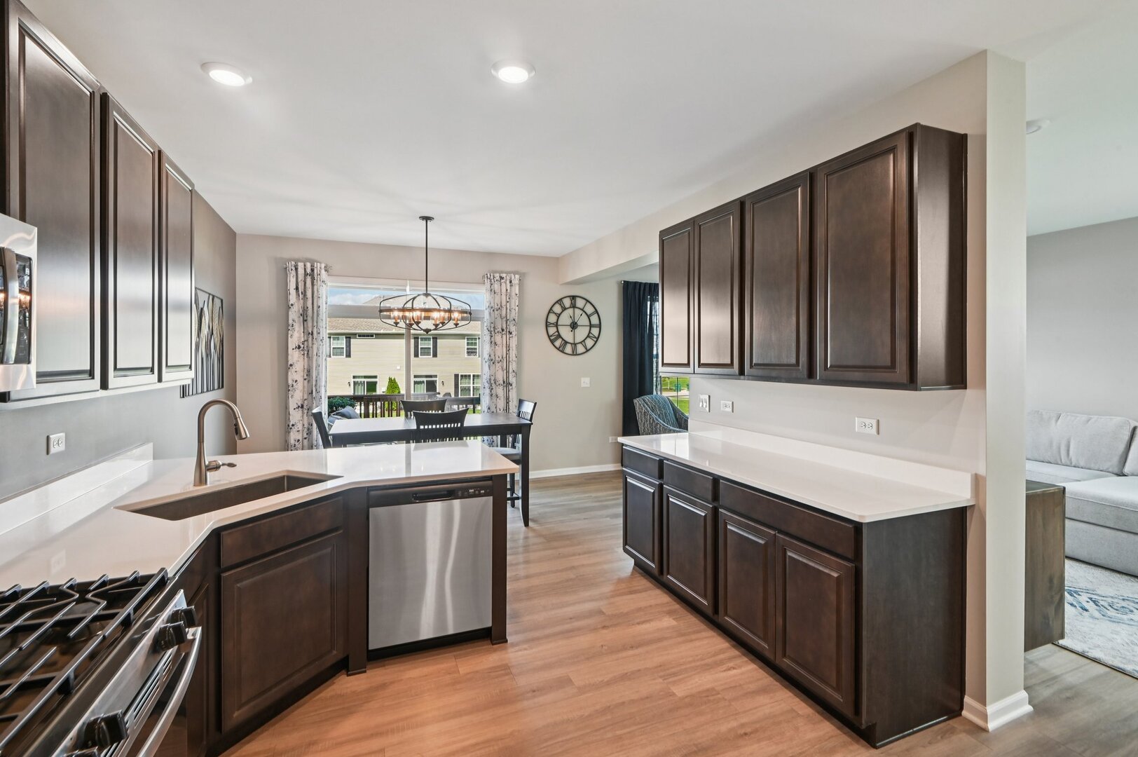 24734 South Dart Road Manhattan, IL 60442 - Photo 5 of 29 a kitchen with stainless steel appliances granite countertop a sink stove and refrigerator