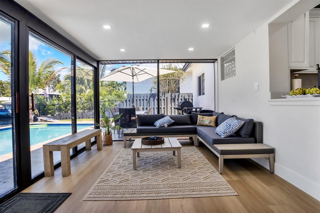 421 Southeast 14th Avenue Pompano Beach, FL 33060 - Photo 13 of 31 a living room with furniture and a large window