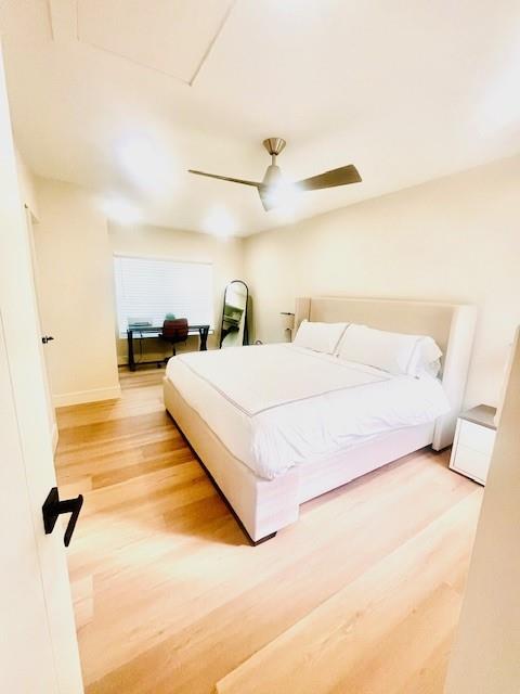 421 Southeast 14th Avenue Pompano Beach, FL 33060 - Photo 25 of 31 a bedroom with a bed and wooden floor