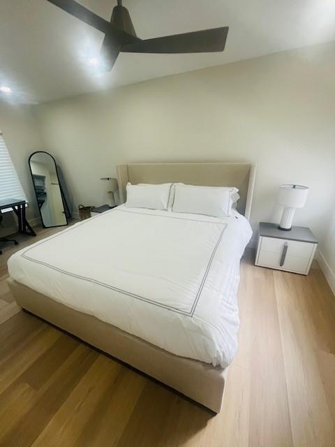 421 Southeast 14th Avenue Pompano Beach, FL 33060 - Photo 28 of 31 a bed sitting in a bedroom next to a lamp