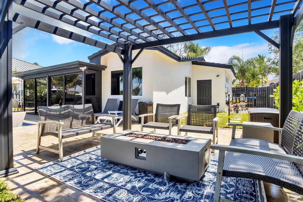 421 Southeast 14th Avenue Pompano Beach, FL 33060 - Photo 29 of 31 a living room with fireplace furniture and a large window