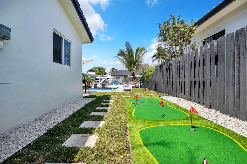 421 Southeast 14th Avenue Pompano Beach, FL 33060 - Photo 30 of 31 a view of swimming pool with a backyard