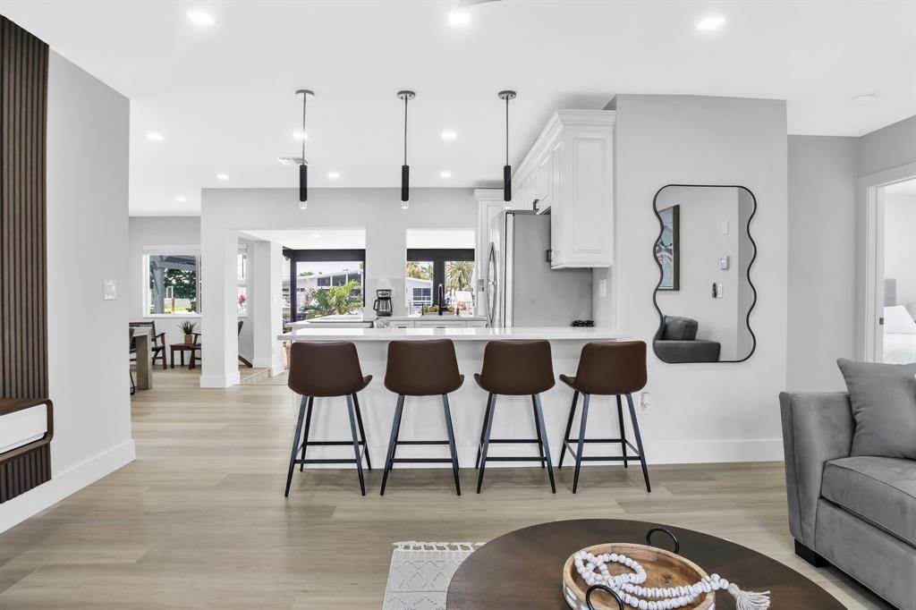 421 Southeast 14th Avenue Pompano Beach, FL 33060 - Photo 7 of 31 a view of a dining room with furniture and wooden floor