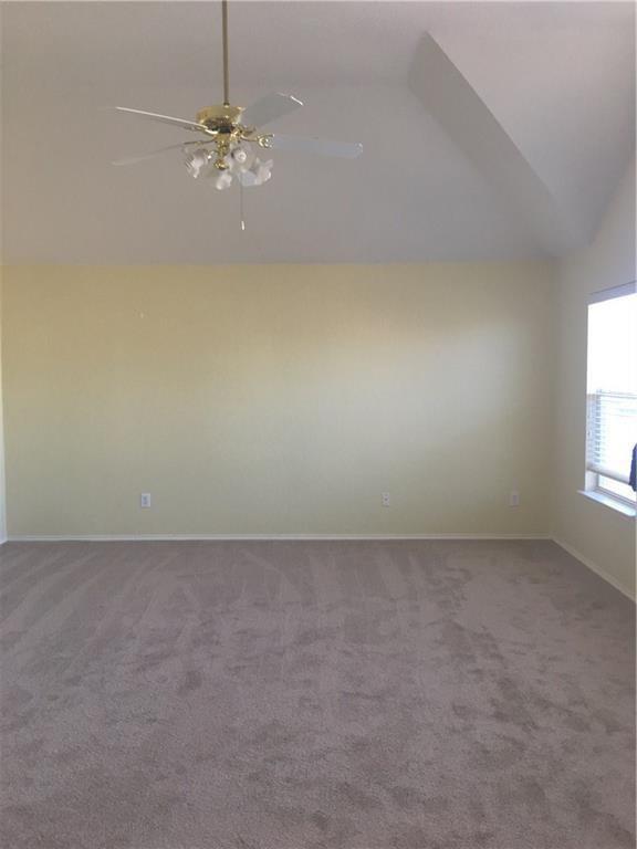 4433 Riptide Lane Plano, TX 75024 - Photo 12 of 12 Vaulted ceiling room featuring light beige walls and neutral tone carpet