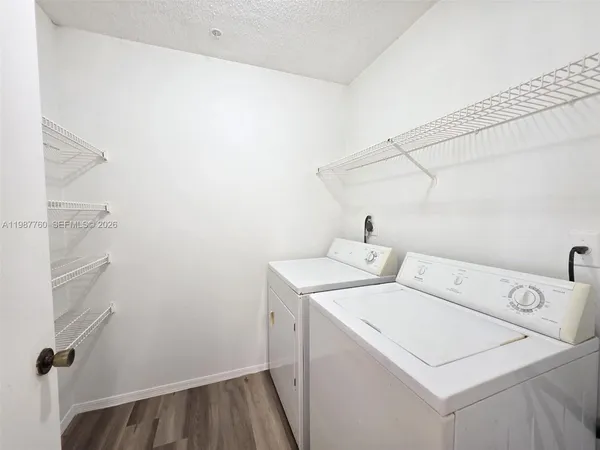 a utility room with dryer and washer