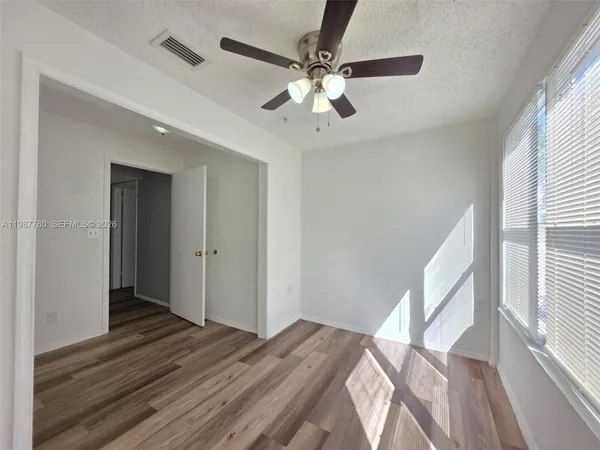 a view of a livingroom with a ceiling fan