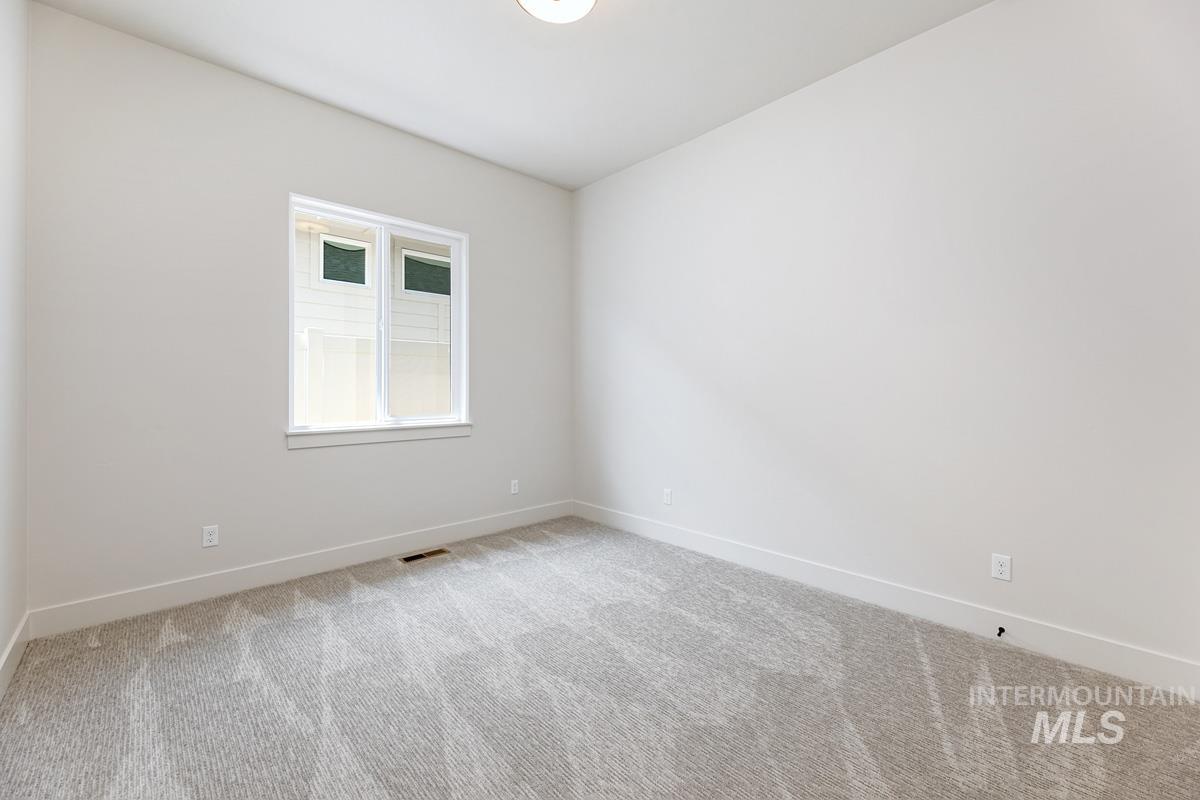 13265 North Spring Creek Way Boise, ID 83714 - Photo 17 of 35 Unfurnished room with baseboards and light colored carpet