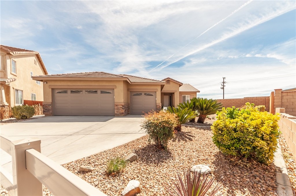 8917 Azalea Springs Road Oak Hills, CA 92344 - Photo 1 of 1 a view of a house with a outdoor space