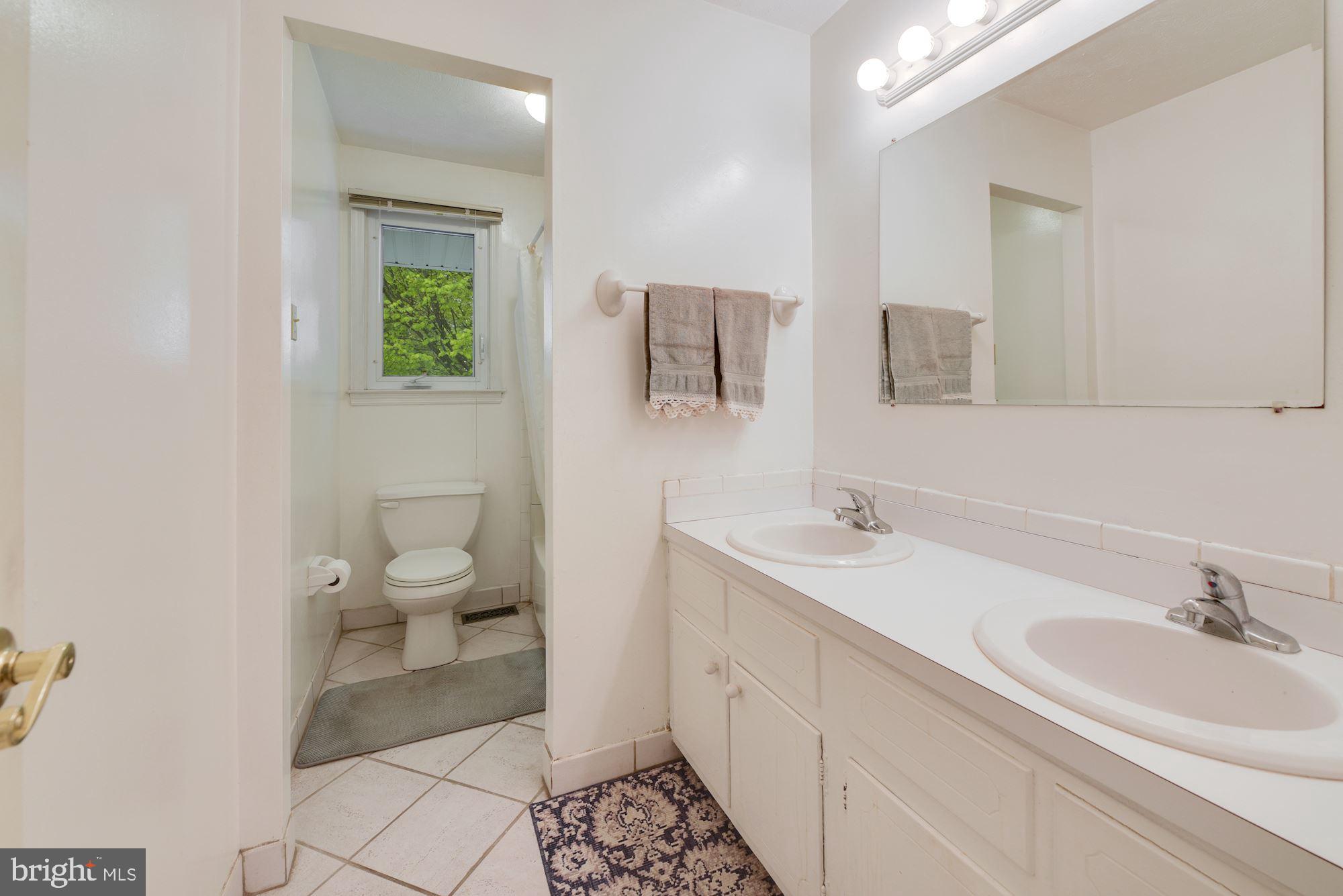 608 Parry Road Cinnaminson, NJ 08077 - Photo 13 of 26 Full bathroom w/tiled floor & tub, 2 sinks