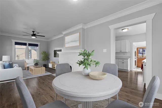 a living room with furniture and potted plant