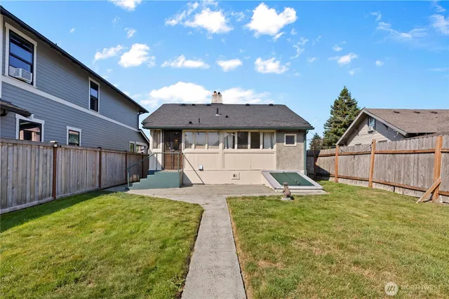 a house with swimming pool in front of it