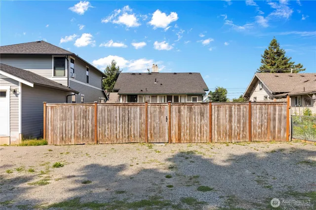 a front view of a house with a wooden fence