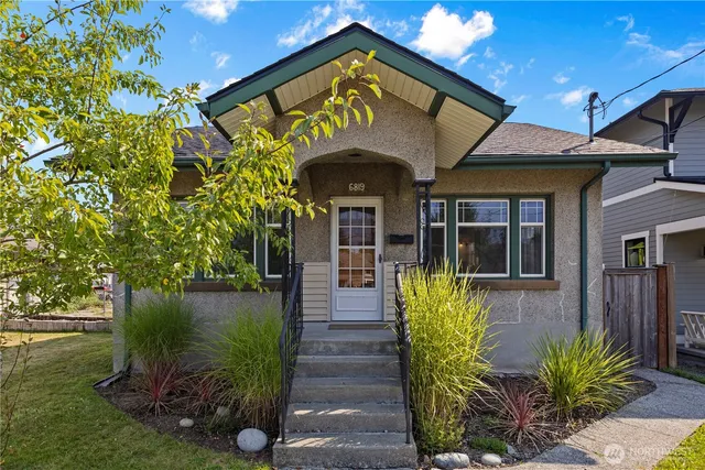 a front view of a house with garden
