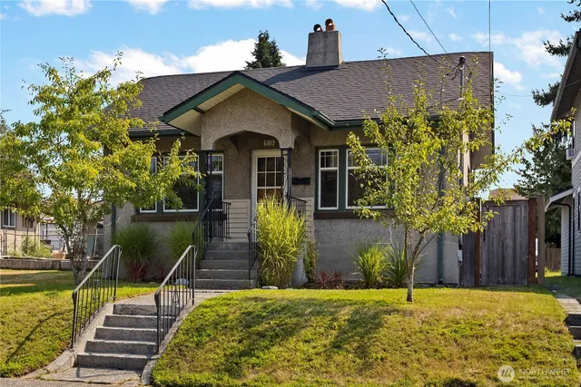 a view of a chair and table on the wooden deck