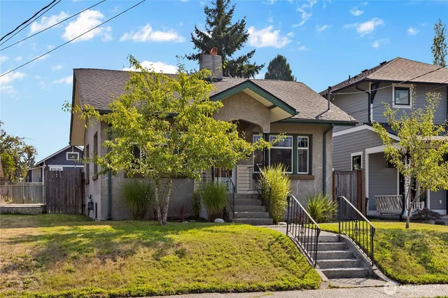 a front view of a house with garden