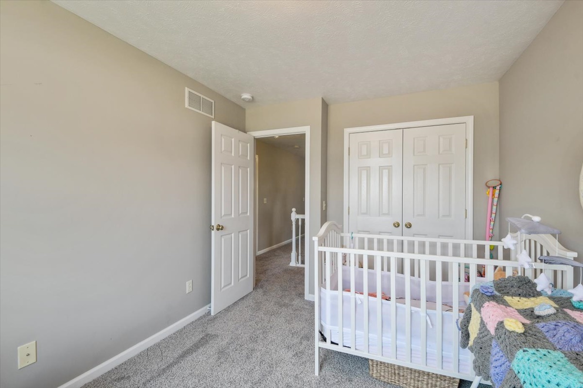 4622 Copper Ridge Road, Unit 4622 Champaign, IL 61822 - Photo 14 of 25 a view of a bedroom with wooden floor