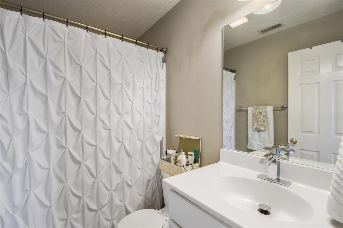 4622 Copper Ridge Road, Unit 4622 Champaign, IL 61822 - Photo 17 of 25 a bathroom with a sink and a mirror