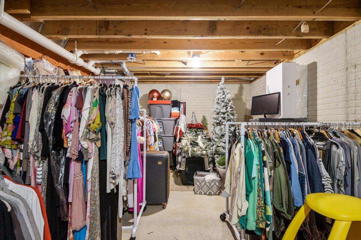 4622 Copper Ridge Road, Unit 4622 Champaign, IL 61822 - Photo 20 of 25 a view of walk in closet with clothes and shoes