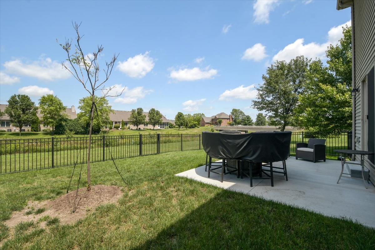 4622 Copper Ridge Road, Unit 4622 Champaign, IL 61822 - Photo 23 of 25 a view of a backyard with sitting area