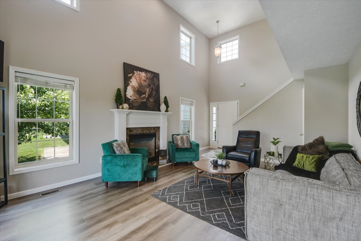 4622 Copper Ridge Road, Unit 4622 Champaign, IL 61822 - Photo 3 of 25 a living room with furniture and a fireplace