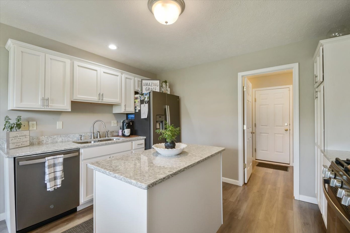 4622 Copper Ridge Road, Unit 4622 Champaign, IL 61822 - Photo 5 of 25 a kitchen with stainless steel appliances granite countertop a sink stove and refrigerator