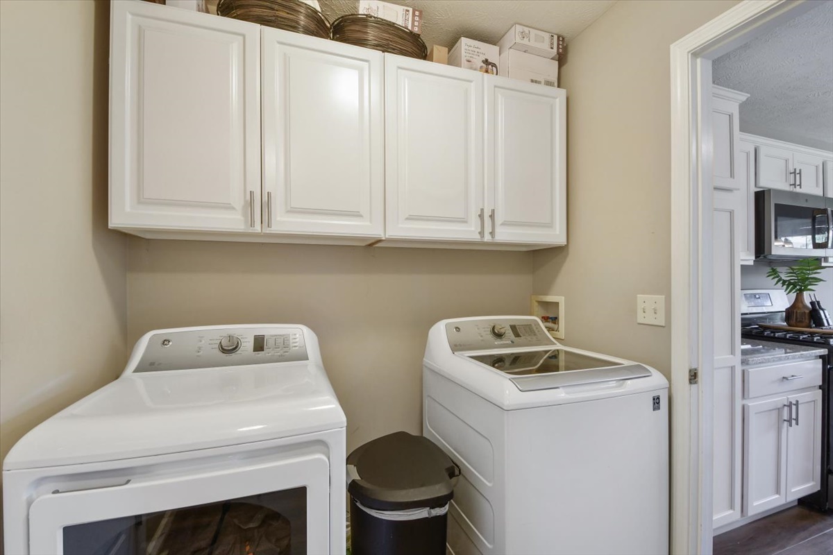 4622 Copper Ridge Road, Unit 4622 Champaign, IL 61822 - Photo 8 of 25 a bathroom with a sink a toilet and cabinets