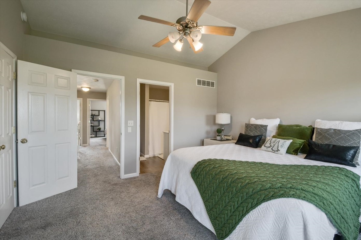 4622 Copper Ridge Road, Unit 4622 Champaign, IL 61822 - Photo 10 of 25 a spacious bedroom with a bed and ceiling fan