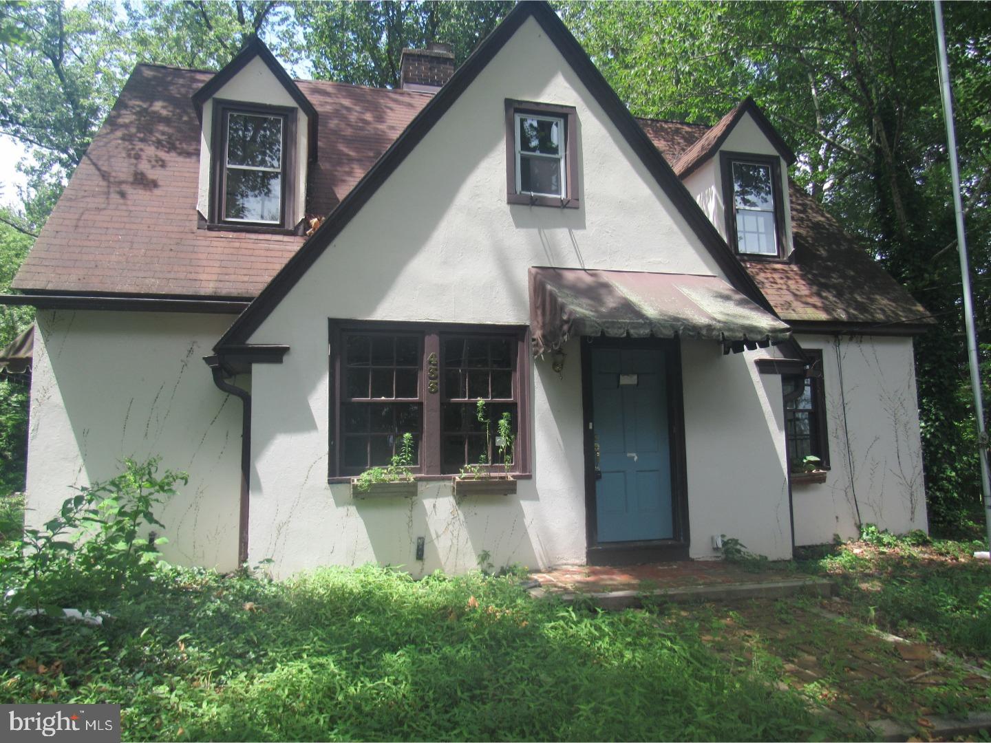 433 Bridgeboro Road Moorestown, NJ 08057 - Photo 2 of 24 a front view of a house with a garden and plants