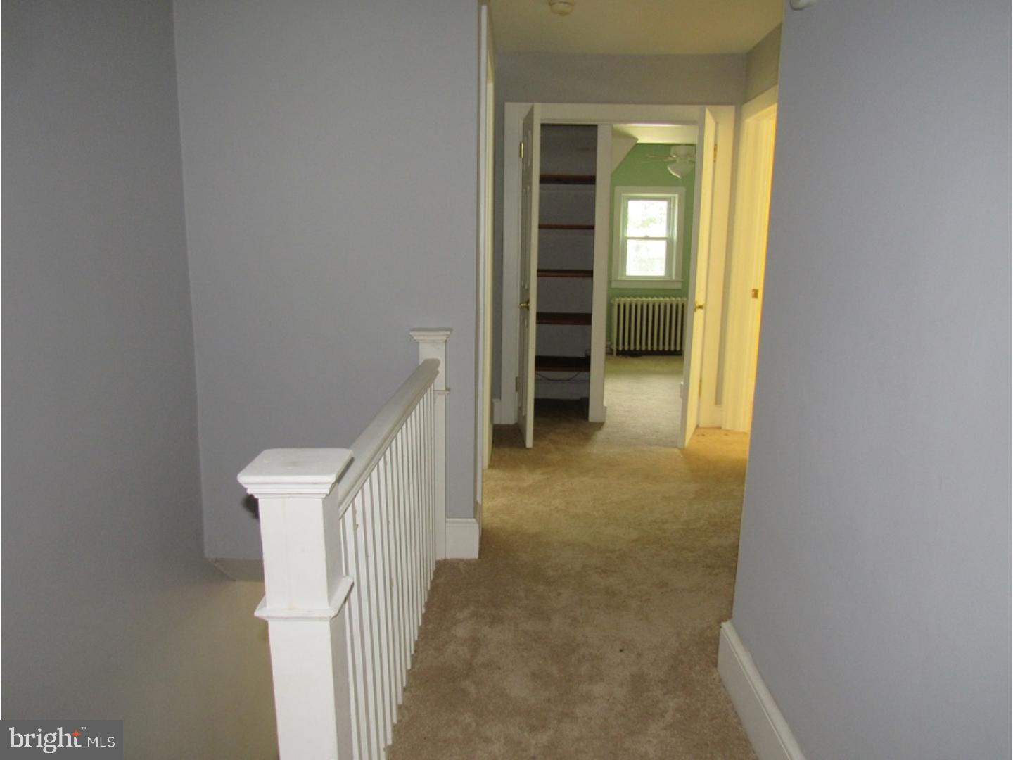 433 Bridgeboro Road Moorestown, NJ 08057 - Photo 14 of 24 a view of a hallway with wooden shelves