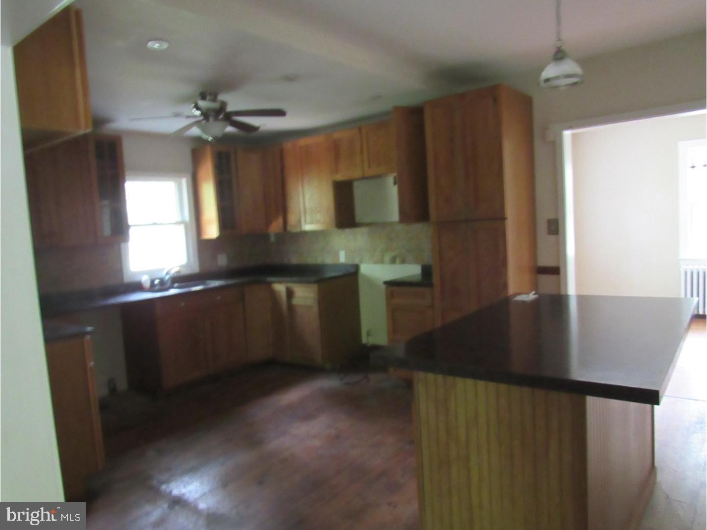 433 Bridgeboro Road Moorestown, NJ 08057 - Photo 17 of 24 a kitchen with stainless steel appliances granite countertop a sink a stove and a refrigerator