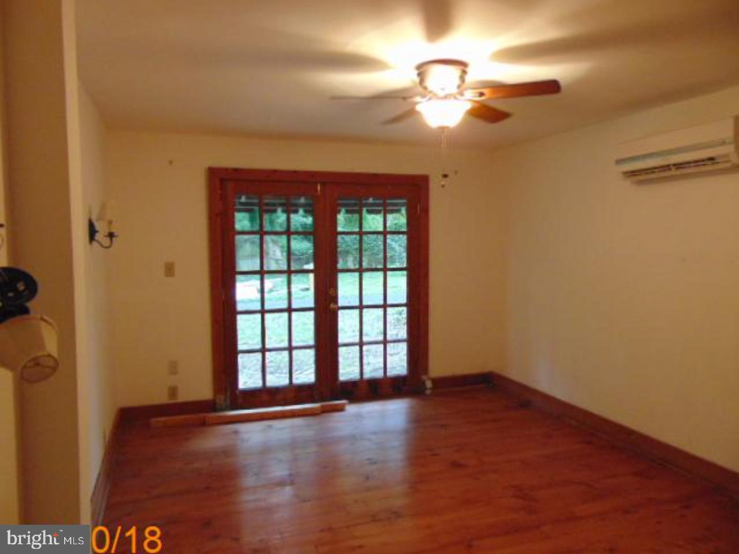 433 Bridgeboro Road Moorestown, NJ 08057 - Photo 21 of 24 wooden floor in an empty room with a window