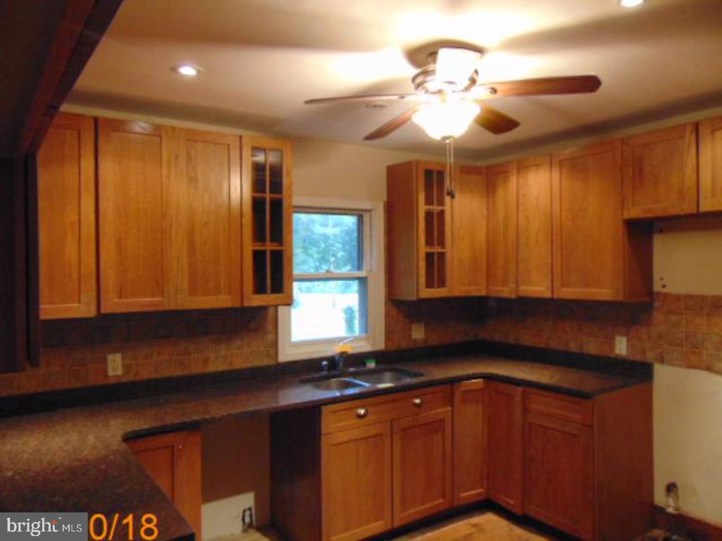 433 Bridgeboro Road Moorestown, NJ 08057 - Photo 22 of 24 a kitchen with stainless steel appliances granite countertop cabinets and a sink