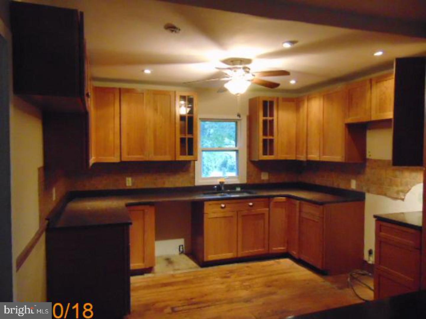 433 Bridgeboro Road Moorestown, NJ 08057 - Photo 5 of 24 a kitchen with stainless steel appliances granite countertop a sink and a stove