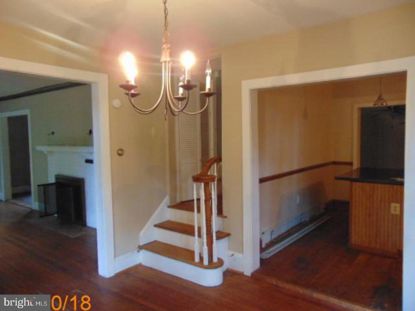 433 Bridgeboro Road Moorestown, NJ 08057 - Photo 7 of 24 a view of a livingroom with wooden floor and a ceiling fan