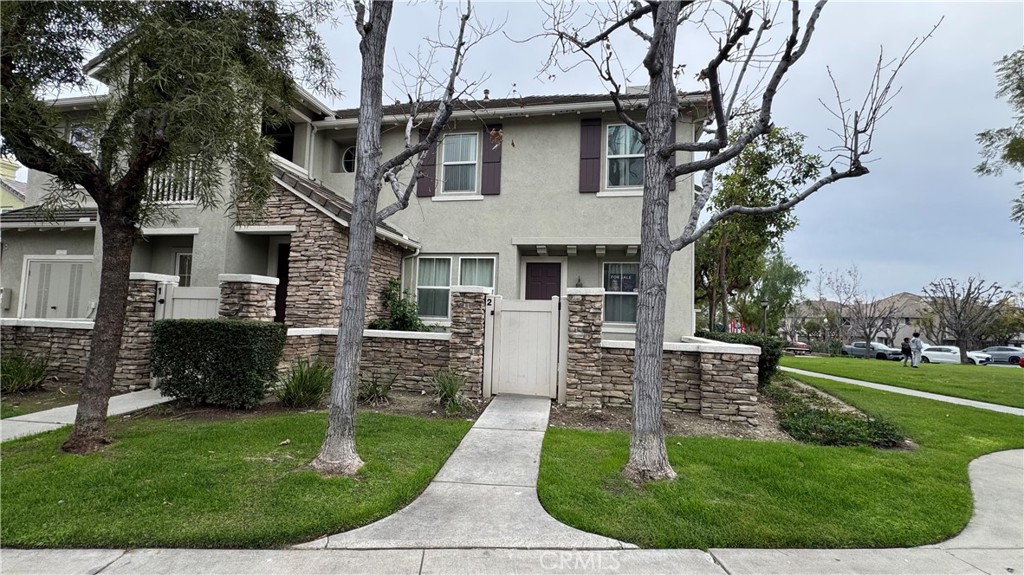12259 Chantrelle Drive Rancho Cucamonga, CA 91739 - Photo 1 of 1 a front view of a house with a yard