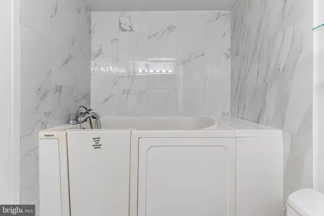 a bathroom with a bathtub and shower