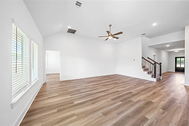 a bedroom with a bed and a chair