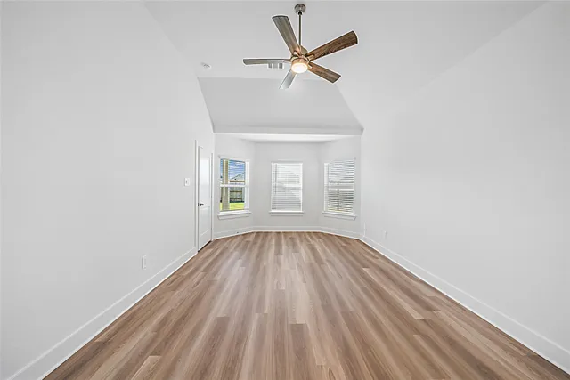 a spacious bathroom with a double vanity sink and mirror