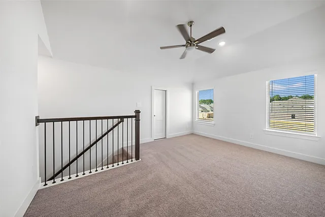 a bedroom with a bed potted plant and a window