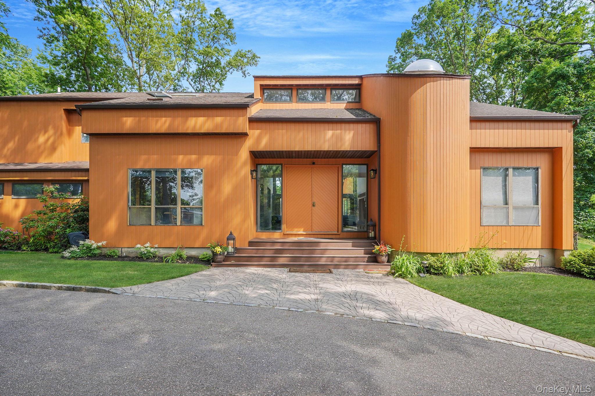 318 Sheep Pasture Road East Setauket, NY 11733 - Photo 3 of 45 a view of a house with small yard plants and large tree