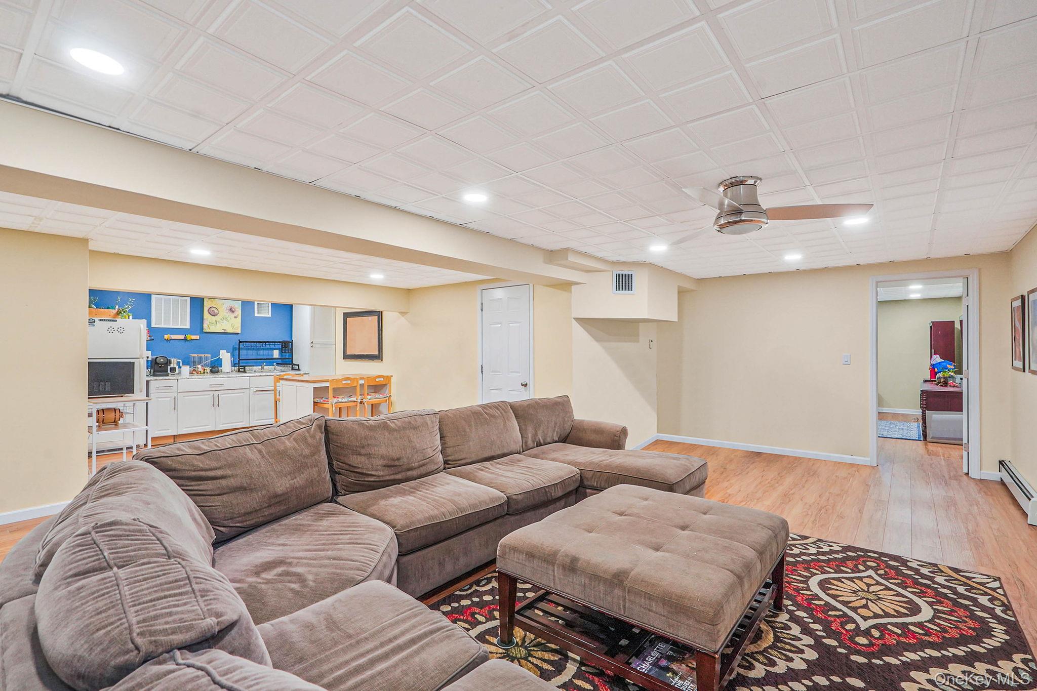318 Sheep Pasture Road East Setauket, NY 11733 - Photo 33 of 45 a living room with furniture and wooden floor
