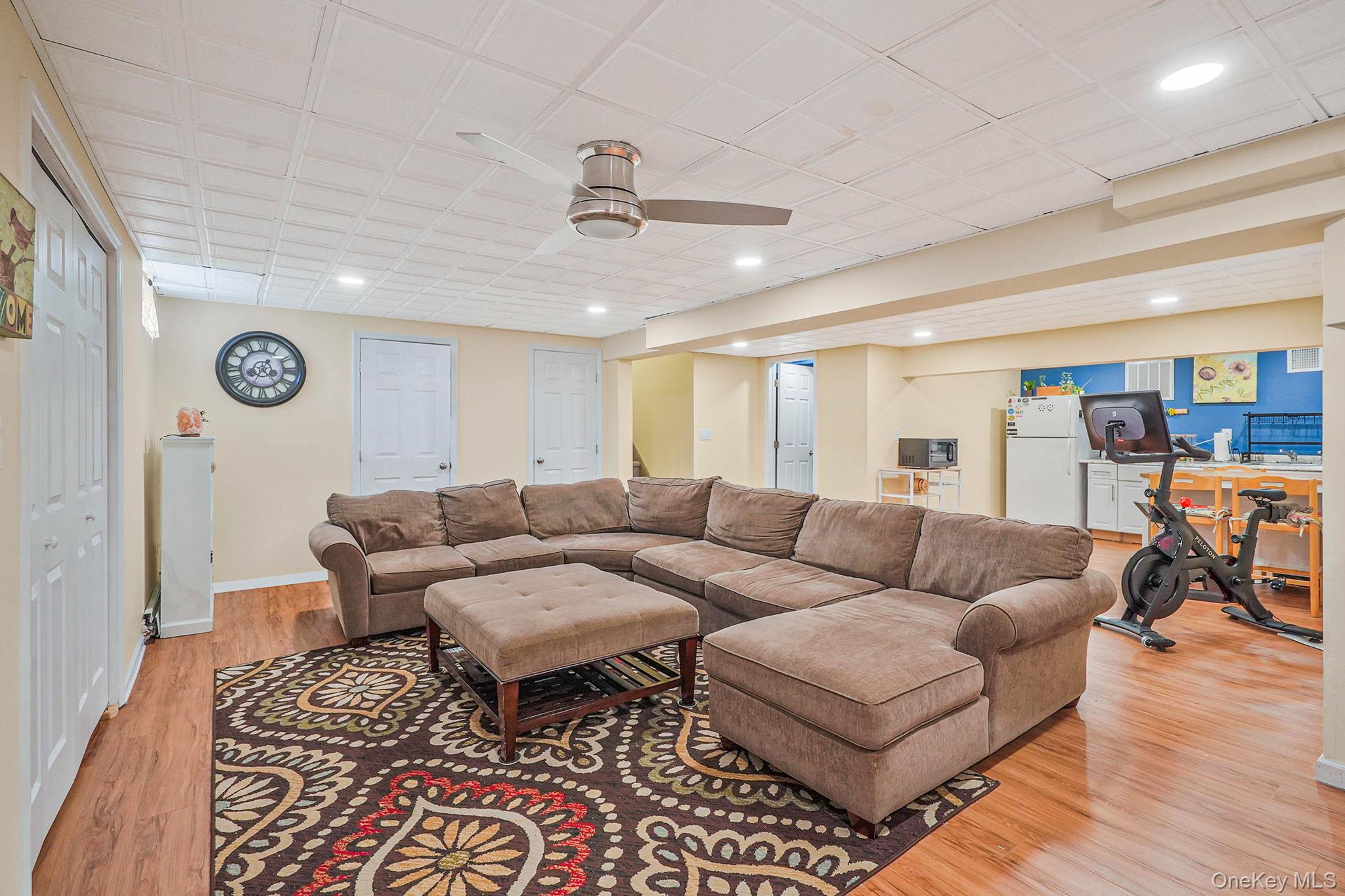 318 Sheep Pasture Road East Setauket, NY 11733 - Photo 34 of 45 a living room with furniture and a wooden floor