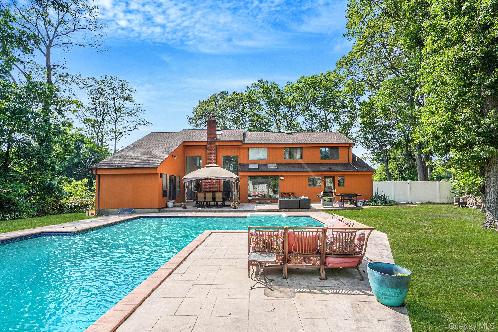 318 Sheep Pasture Road East Setauket, NY 11733 - Photo 39 of 45 a view of a house with a yard